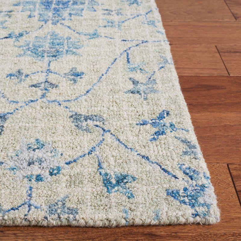 Handmade Tufted Blue Floral Wool Accent Rug