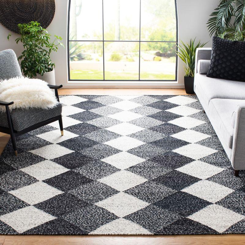 Handmade Black and Ivory Wool Flat Woven Area Rug