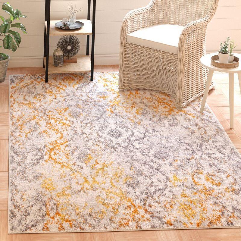 Ivory and Orange Damask Low Pile Area Rug