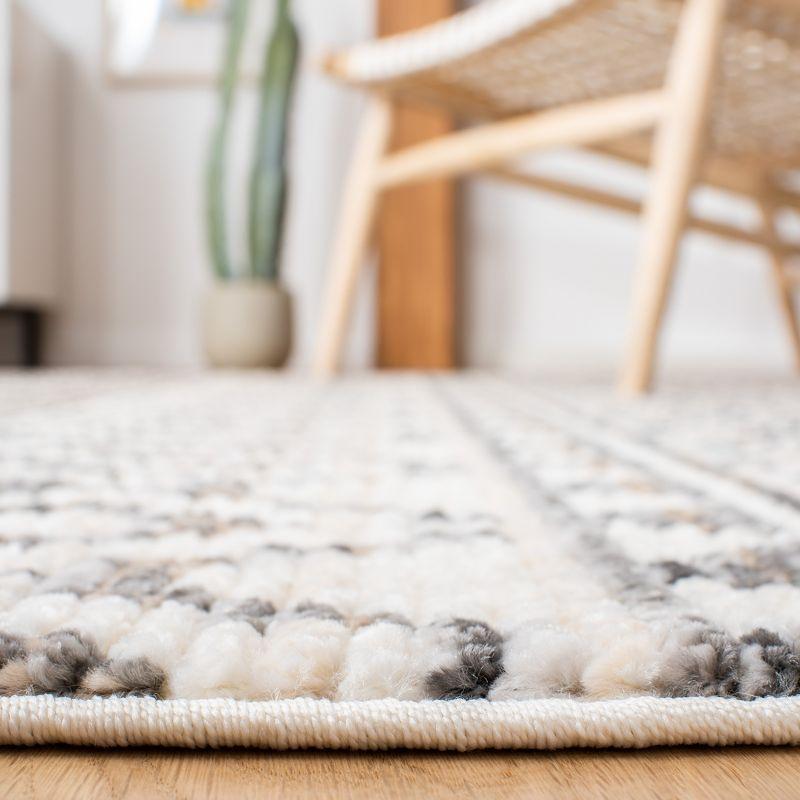 Ivory and Grey Synthetic Boho Area Rug