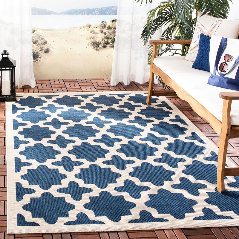 Navy and Beige Synthetic Easy-Care Indoor/Outdoor Area Rug 6'7" x 9'6"