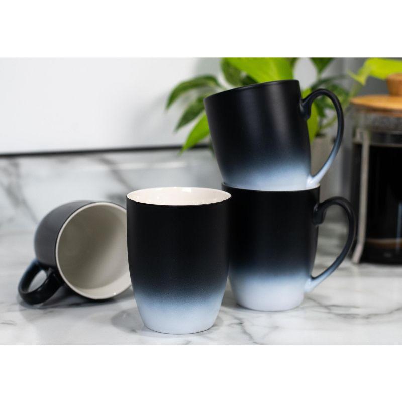 Elanze Designs Baby, It's Cold Outside Two Toned Ombre Matte Black and White 12 ounce Ceramic Stoneware Coffee Cup Mug