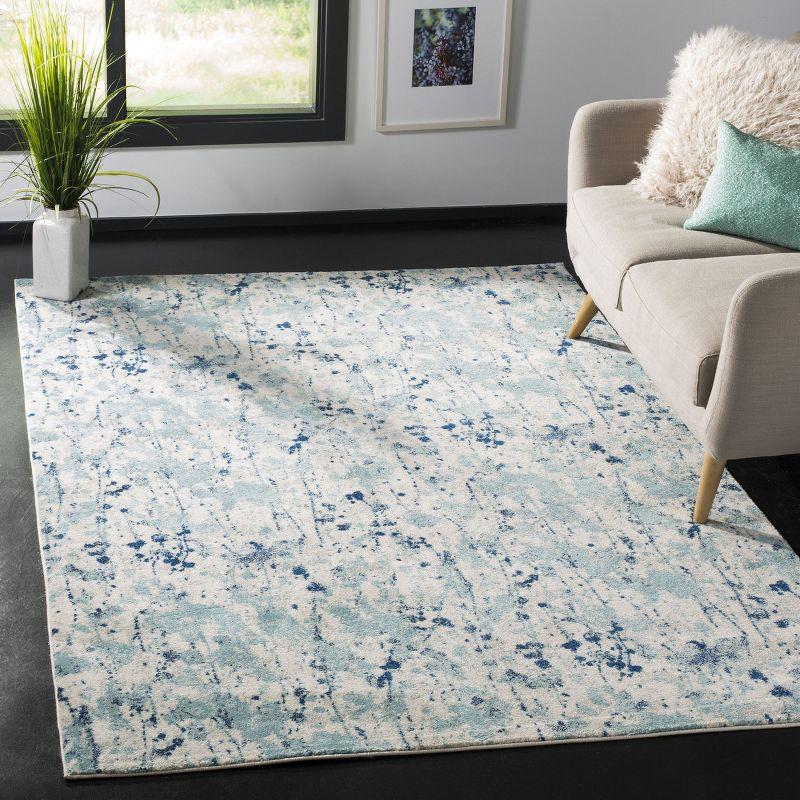 Ivory and Blue Reversible Easy-Care Synthetic Area Rug