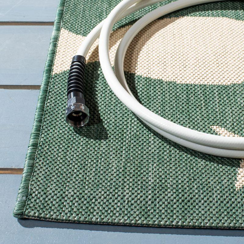 Elegant Dark Green and Ivory Synthetic Indoor/Outdoor Rug - 4' x 5'7"