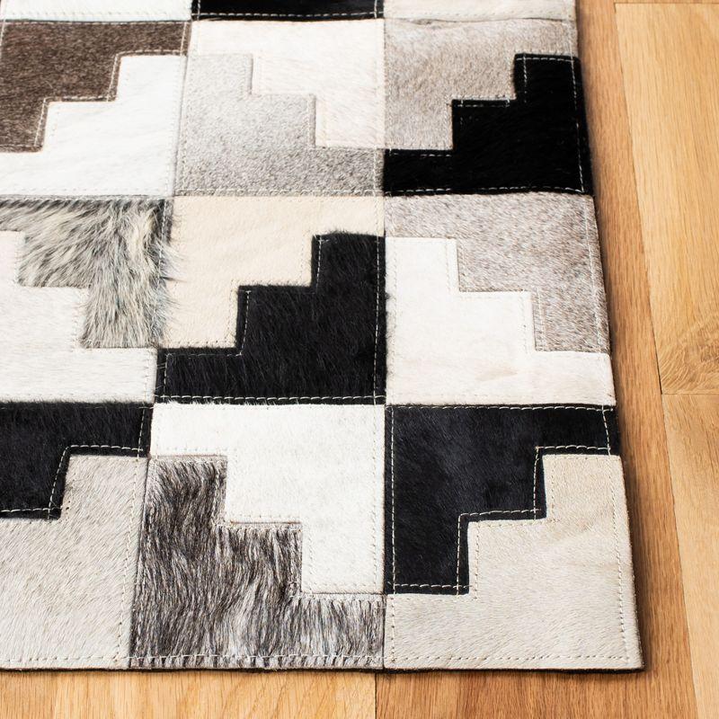 Handmade Black and Ivory Geometric Cowhide Area Rug, 3' x 5'