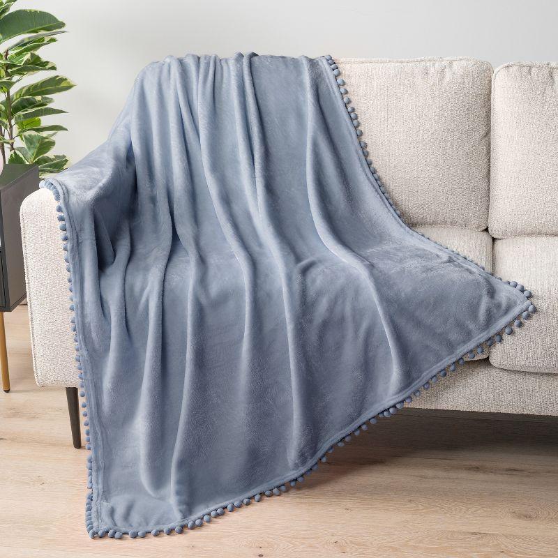 PAVILIA Fleece Pom Pom Blanket Throw for Sofa Bed, Soft Lightweight Pompom Fringe Blanket for Couch