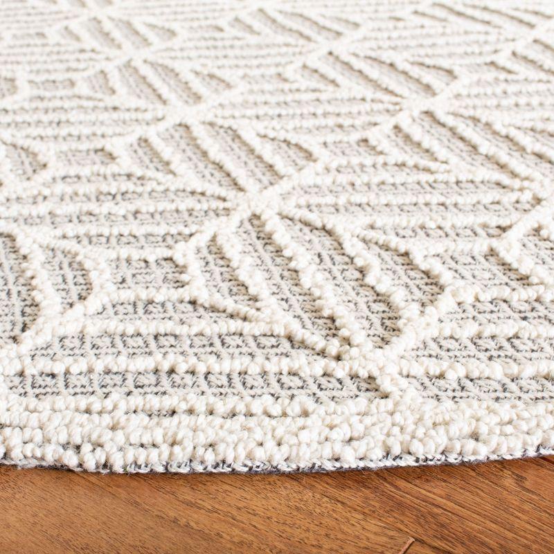 Trace TRC212 Hand Tufted Area Rug - Ivory/Black - 6' Round - Safavieh.