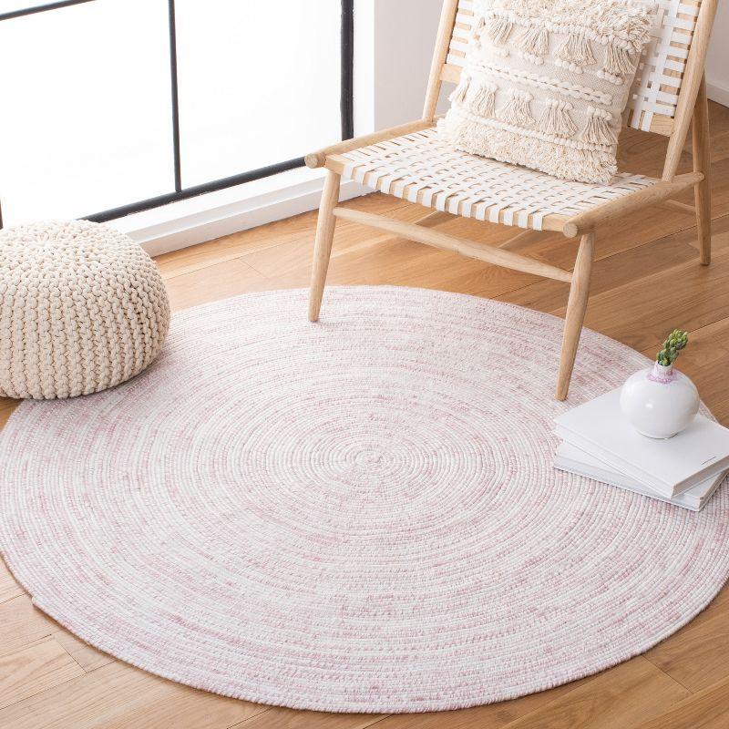 Ivory and Pink Round Braided Synthetic Area Rug