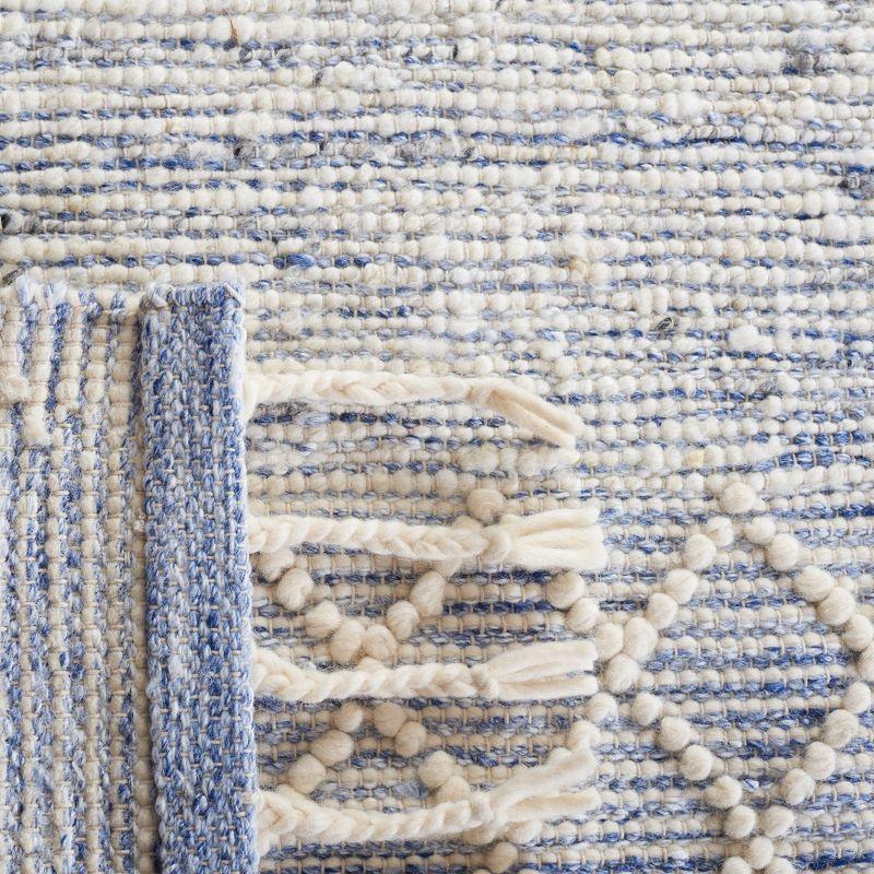 Ivory and Blue Handwoven Wool Area Rug with Fringe