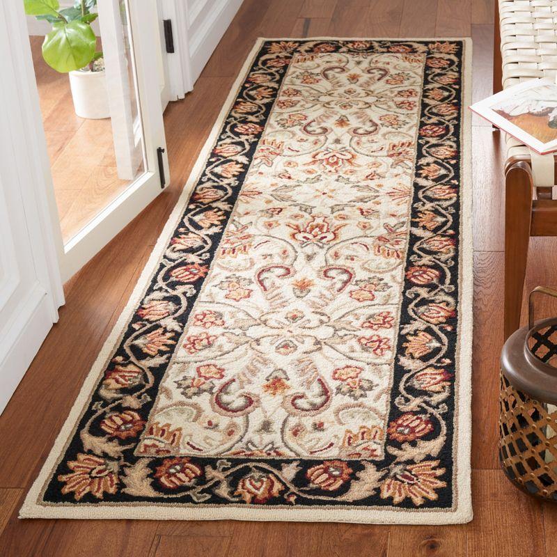 Ivory and Black Hand-Hooked Synthetic Runner Rug