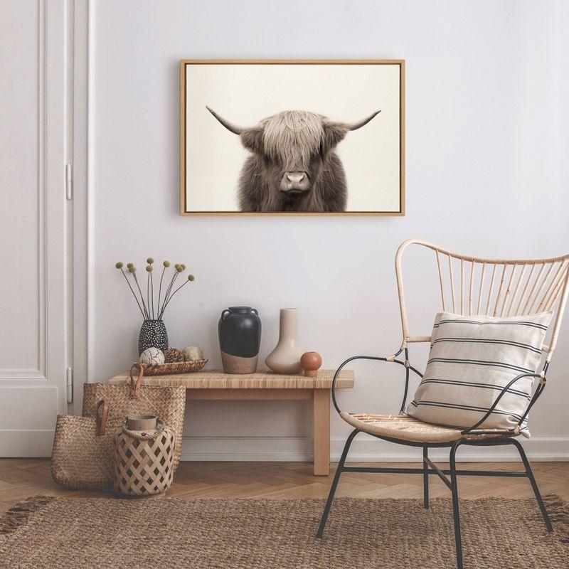 23" x 33" Sylvie Highland Cow Color Framed Canvas by The Creative Bunch Studio Natural - Kate and Laurel