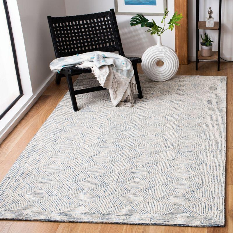 Handmade Blue Wool Tufted 5' x 8' Area Rug