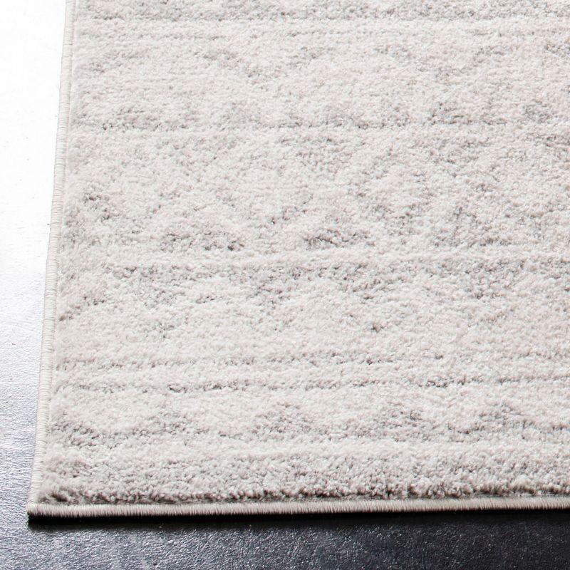 Ivory and Gray Rectangular Synthetic Area Rug