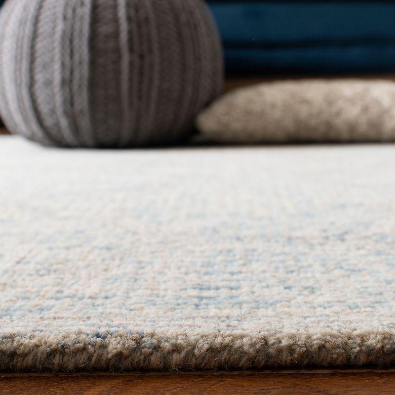 Ivory and Light Blue Handmade Wool Abstract Area Rug