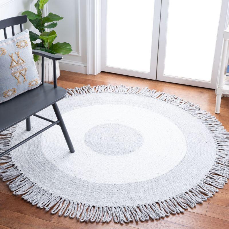 Handmade Round Ivory Synthetic Area Rug, 7' Diameter