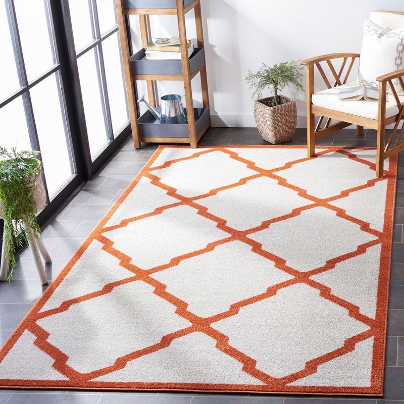 Beige & Orange Geometric Round Synthetic Area Rug 6' x 9'