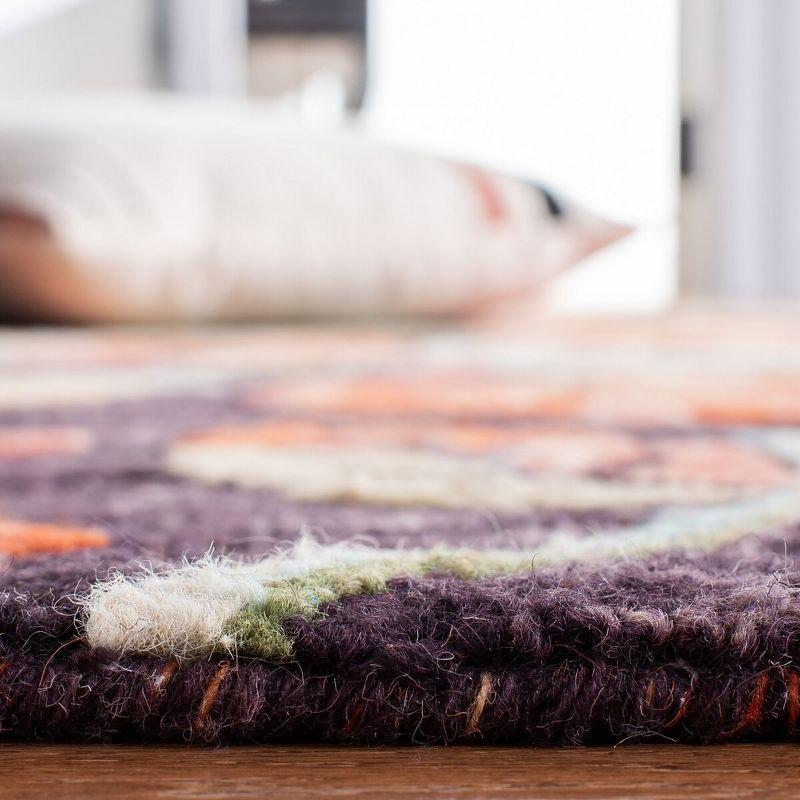 Handmade Round Floral Blue and Orange Wool Area Rug