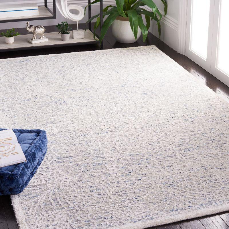 Blue and Ivory Tufted Wool Geometric Area Rug 5' x 8'