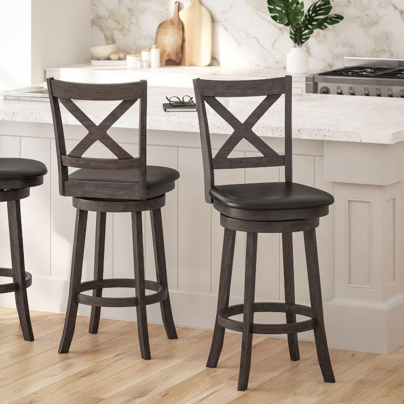 Merrick Lane 30" Gray Wash Walnut Classic Wooden Crossback Swivel Bar Height Pub Stool with Black Faux Leather Padded Seat and Integrated Footrest