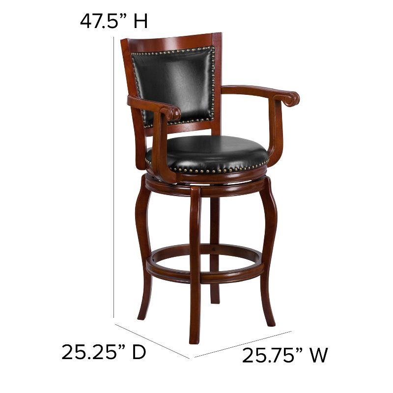 Emma and Oliver 30"H Cherry Wood Panel Back Swivel Barstool with Arms