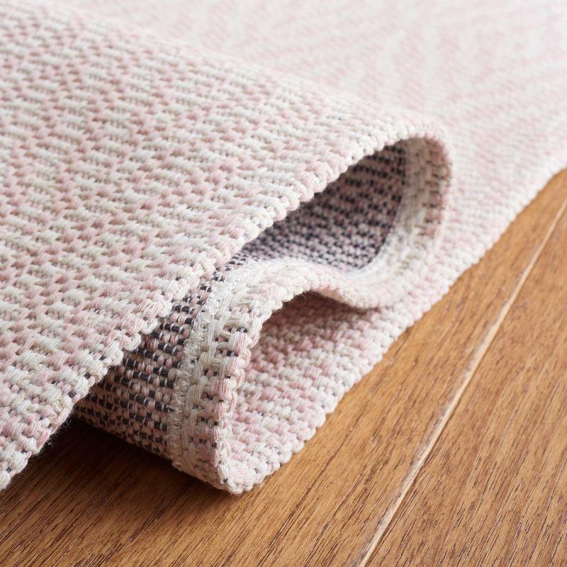 Handmade Pink and Ivory Wool 5' x 7' Reversible Braided Rug