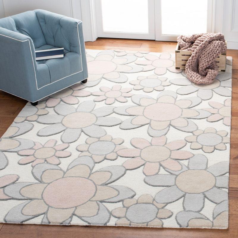 Safavieh Kids SFK923 Hand Tufted Area Rug - Ivory/Pink - 3'x5' - Safavieh.