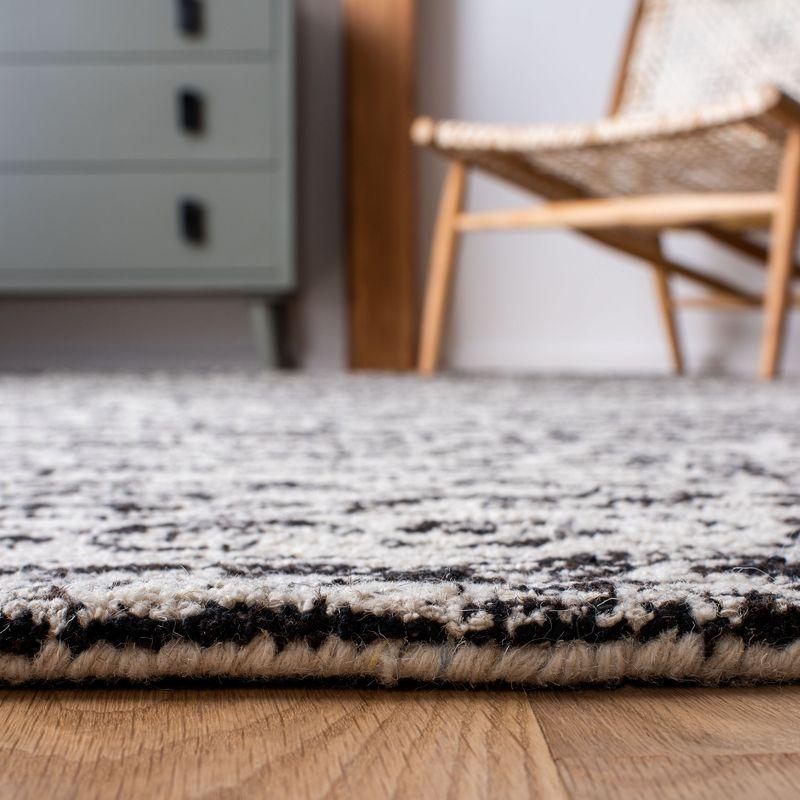 Ivory and Black Hand-Tufted Round Wool Area Rug