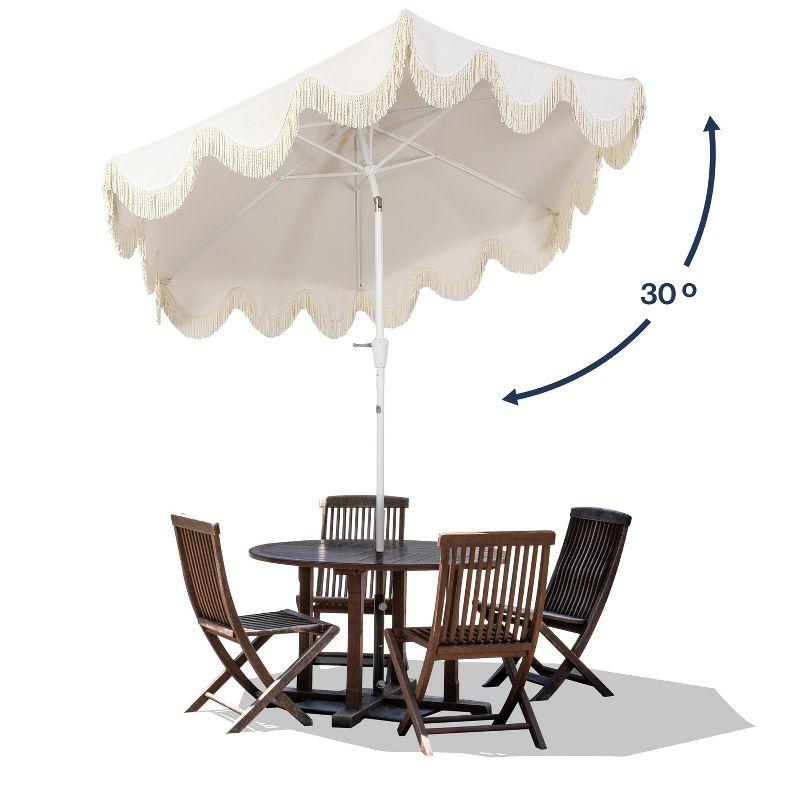 JONATHAN Y Collins 9 ft. Classic Cottage Tassel Market Patio Umbrella with Auto-Tilt, Crank, Wind Vent and UV Protection in Cream