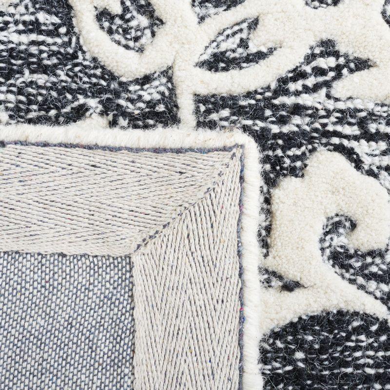 Metro MET853 Hand Tufted Indoor Area Rug - Black/Ivory - 6'x6' - Safavieh