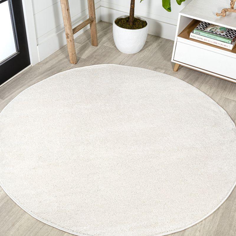 Cream Round Low-Pile Synthetic Area Rug, 4 ft.