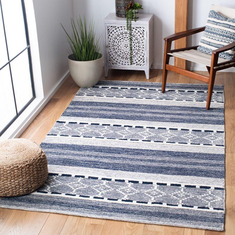 Ivory and Navy Handmade Kilim Wool Area Rug with Cowhide Accents