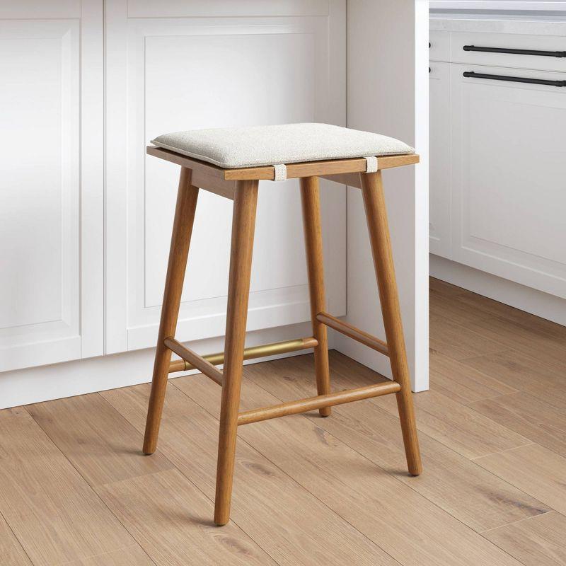 Nathan James Barker Counter Height Barstool: Padded Saddle Seat, Solid Rubberwood Legs, 24" Tall