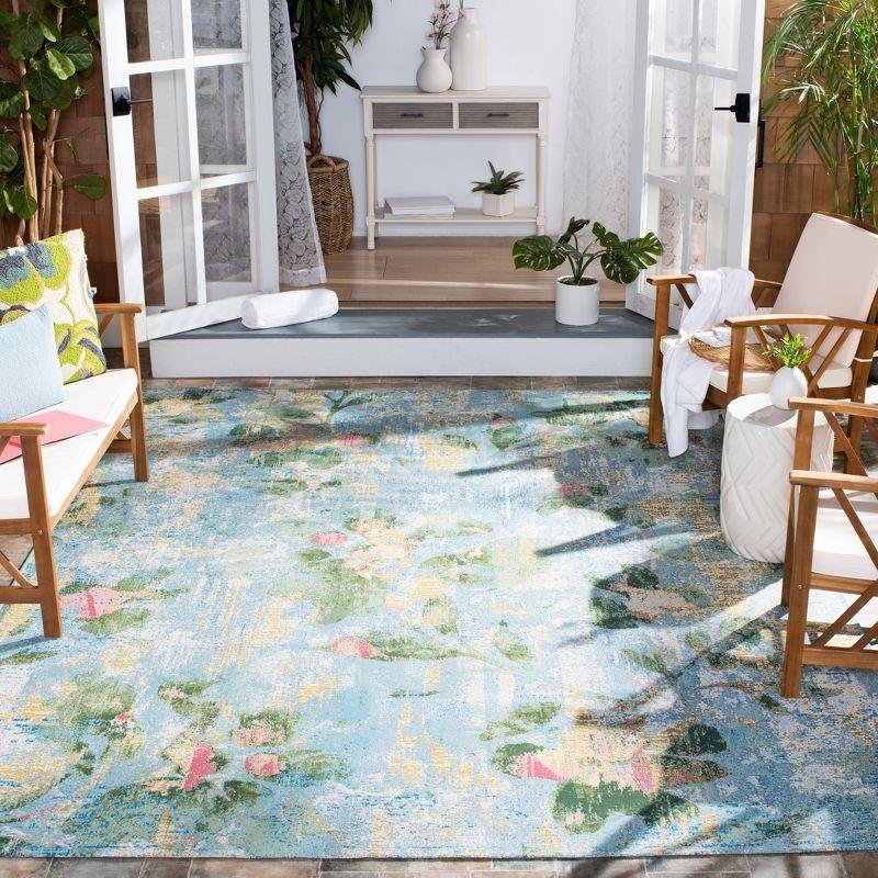 Lush Tropical Light Blue Floral 8' x 10' Synthetic Area Rug