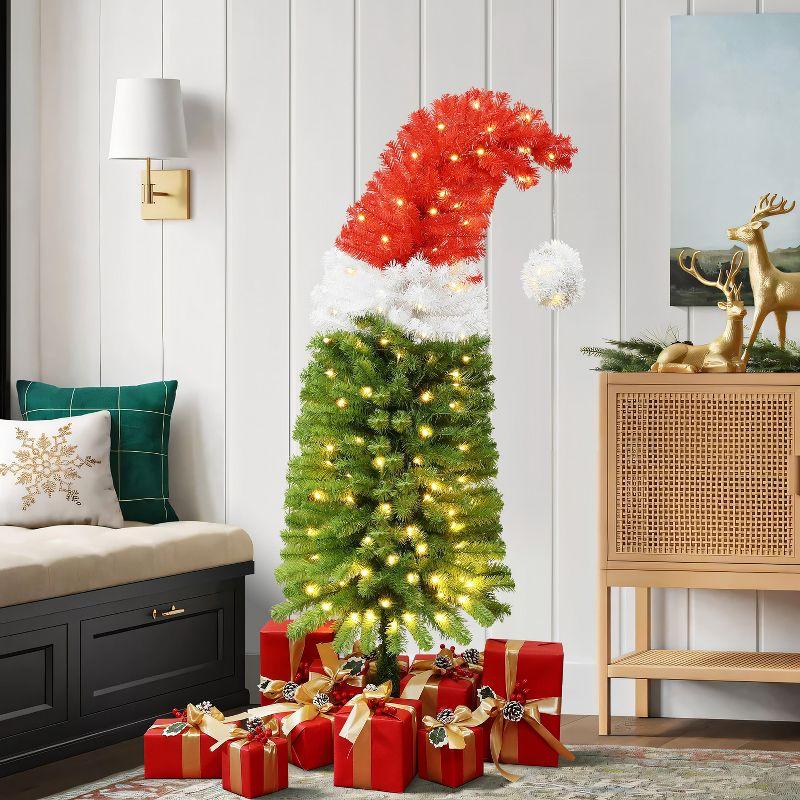 LuxenHome 5Ft Pre-Lit Artificial Tree with Santa Hat Treetop Multicolored