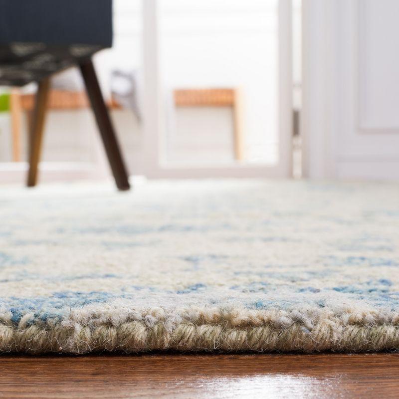 Handmade Tufted Blue Floral Wool Accent Rug