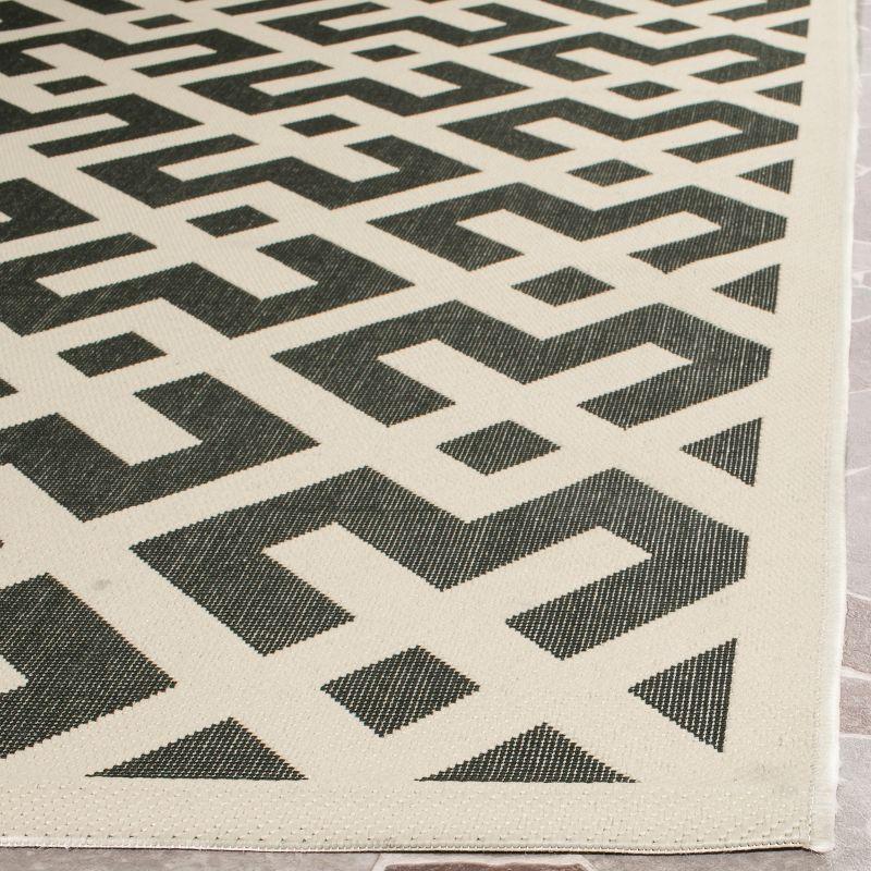 Black and Beige Geometric Synthetic Indoor/Outdoor Rug, 2'-4" x 14'