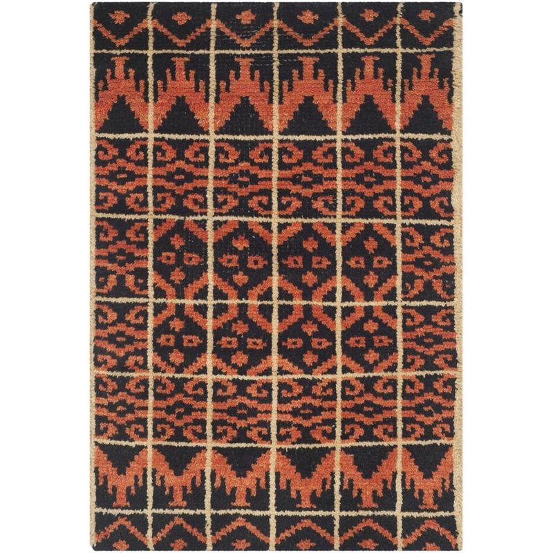 Union Rustic Alimatou Hand Knotted Wool/Cotton Southwestern Rug in Orange/Black