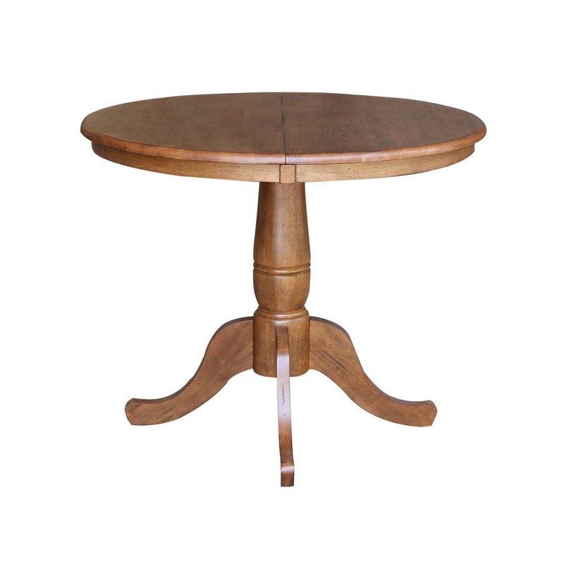 Keanan Round Top Pedestal Table with 12" Drop Leaf Distressed Oak - International Concepts