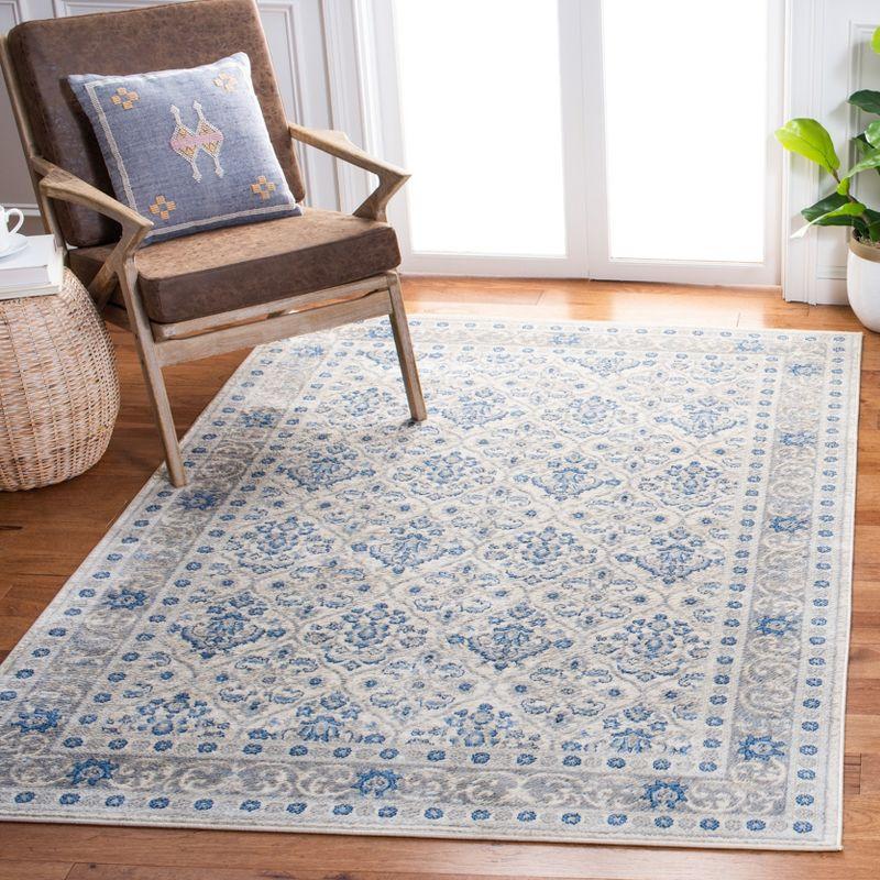 Ivory and Blue Hand-knotted Rectangular Synthetic Rug