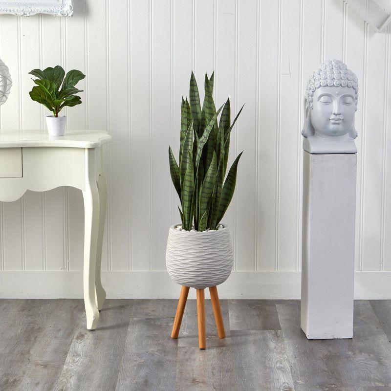 Elevated Outdoor 53" Plastic Potted Faux Sansevieria Plant