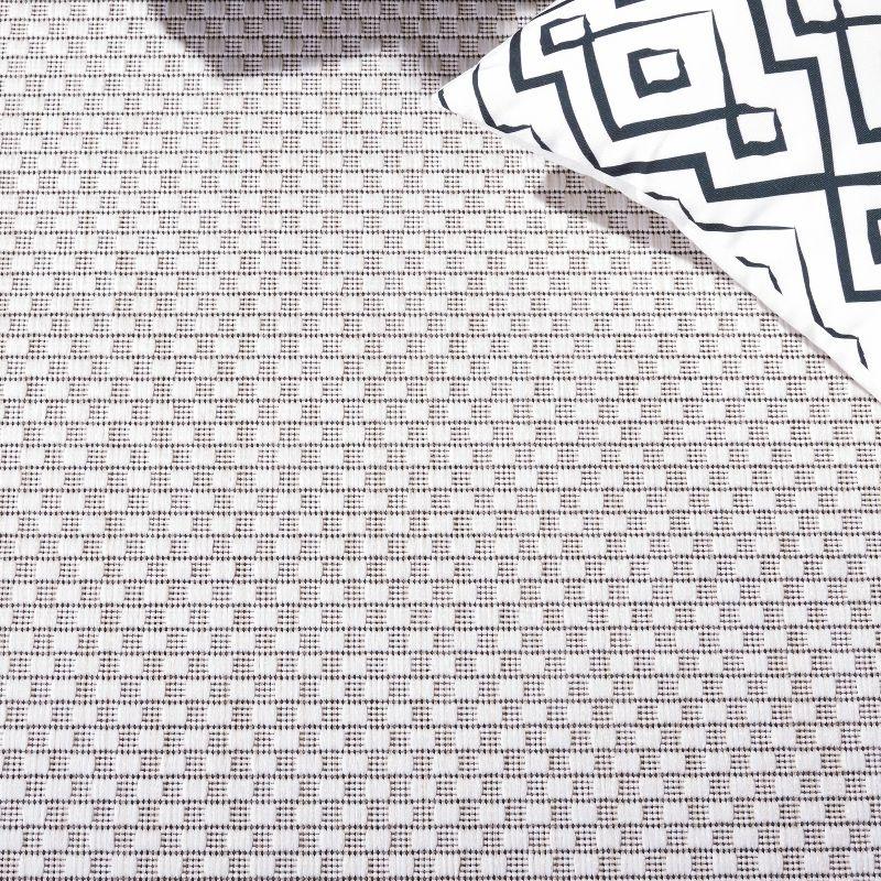 Ivory and Black Reversible Synthetic Indoor/Outdoor Rug