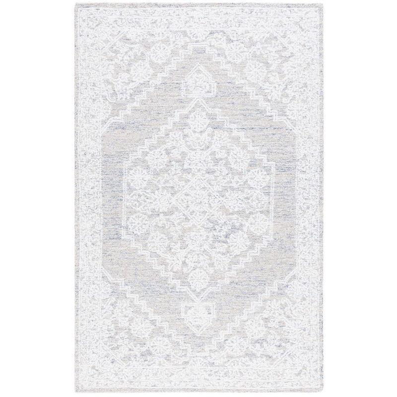 Ivory Tufted Handmade Wool and Synthetic 6' x 9' Area Rug