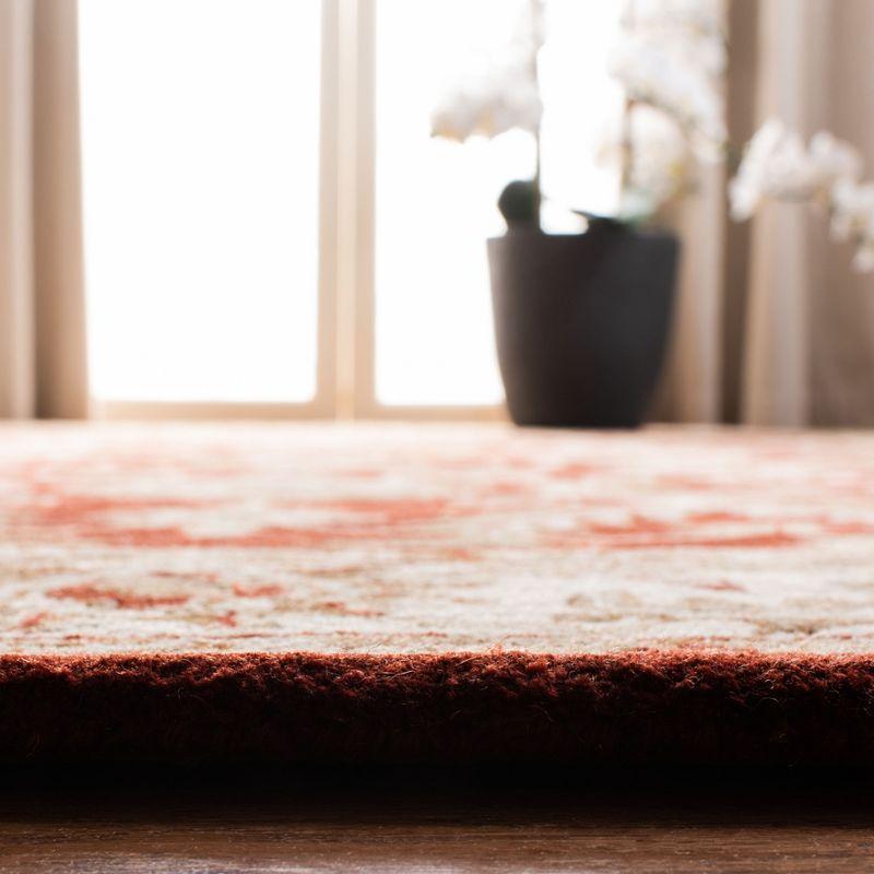 Handmade Red and Ivory Tufted Wool Area Rug