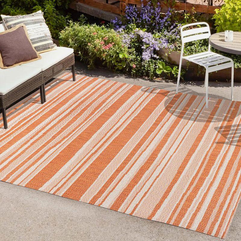 Castara Chic Orange & Cream Striped Synthetic 5x8 Area Rug