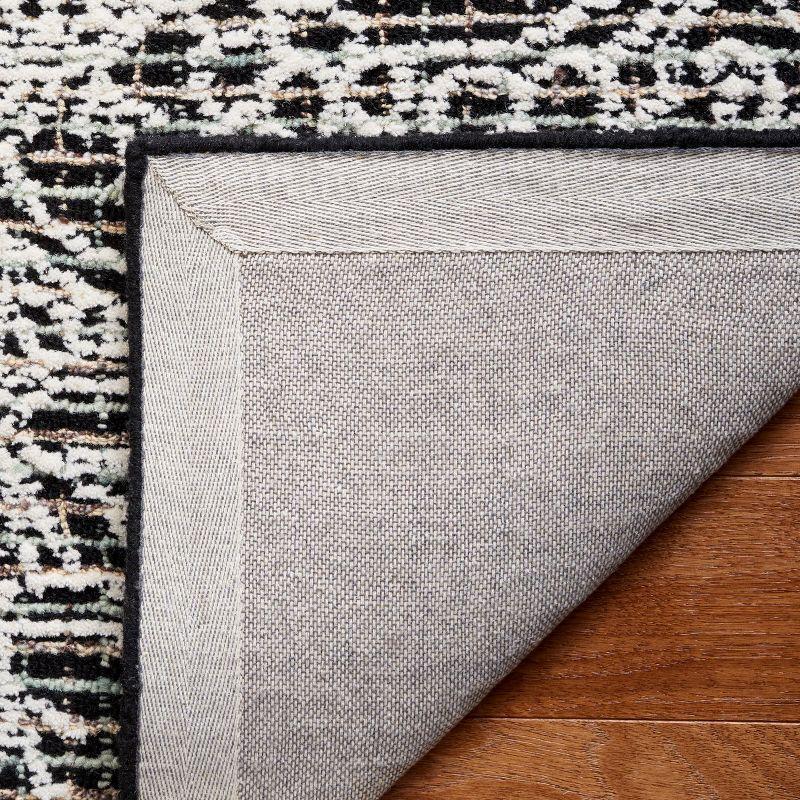 Ebony EBN114 Hand Tufted Area Rug - Black/Ivory - 6'x9' - Safavieh.