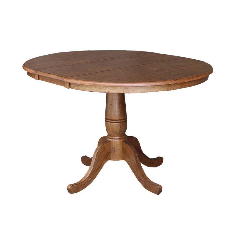 Keanan Round Top Pedestal Table with 12" Drop Leaf Distressed Oak - International Concepts