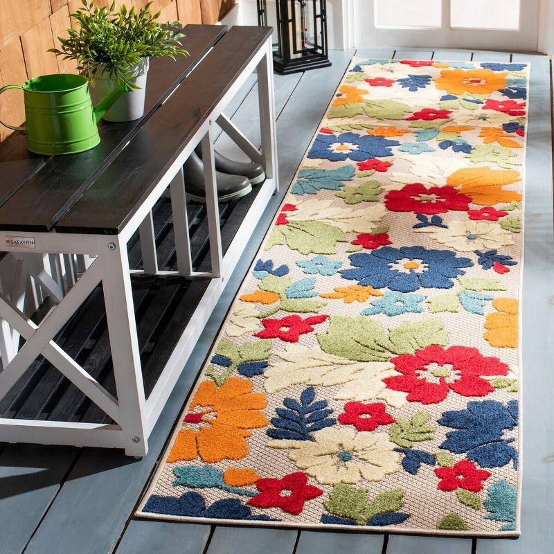 Ivory and Orange Floral Synthetic Outdoor Rug, 26" x 9'