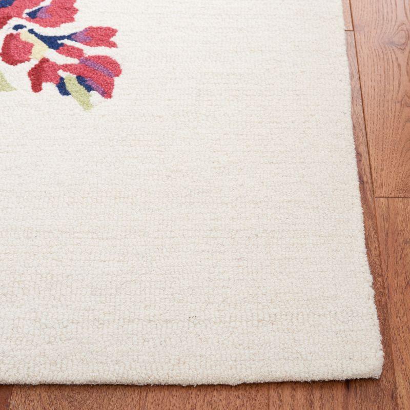 Chelsea HK219 Hand Tufted Area Rug - Ivory/Rose - 5'x8' - Safavieh.