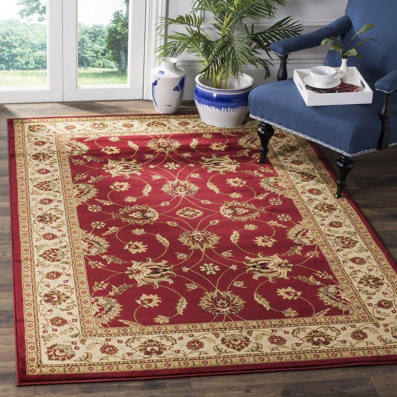 Red and Ivory 4' x 6' Synthetic Safavid Style Area Rug