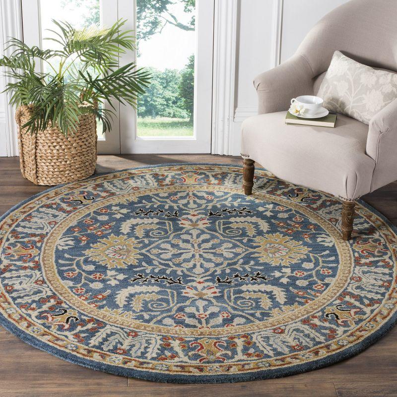 Antiquity AT64 Hand Tufted Area Rug - Dark Blue/Multi - 6' Round - Safavieh.